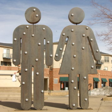 Steel sculpture of man and woman bathroom icons by Andy Miller
