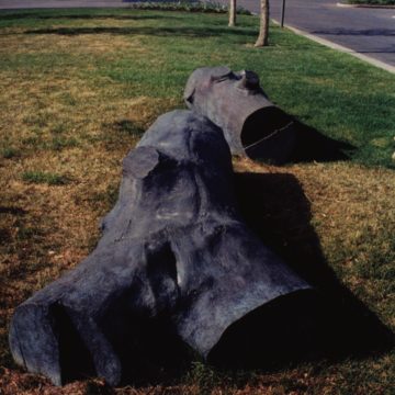 realistic bronze log sculpture by Dennis Leon
