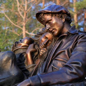 bronze sculpture of a man and woman embracing by George Lundeen