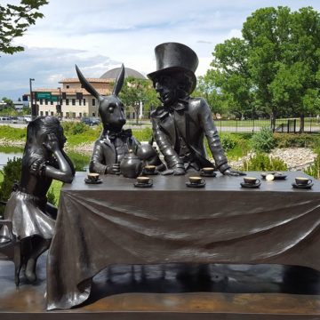 Bronze sculpture depicting the mad tea party from Alice in Wonderland