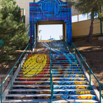 celestial mosaic stairway by Reven Swanson with archway mural by AJ Davis
