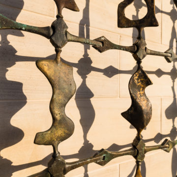 detail of bronze abstract wall sculpture by Neil Goodman